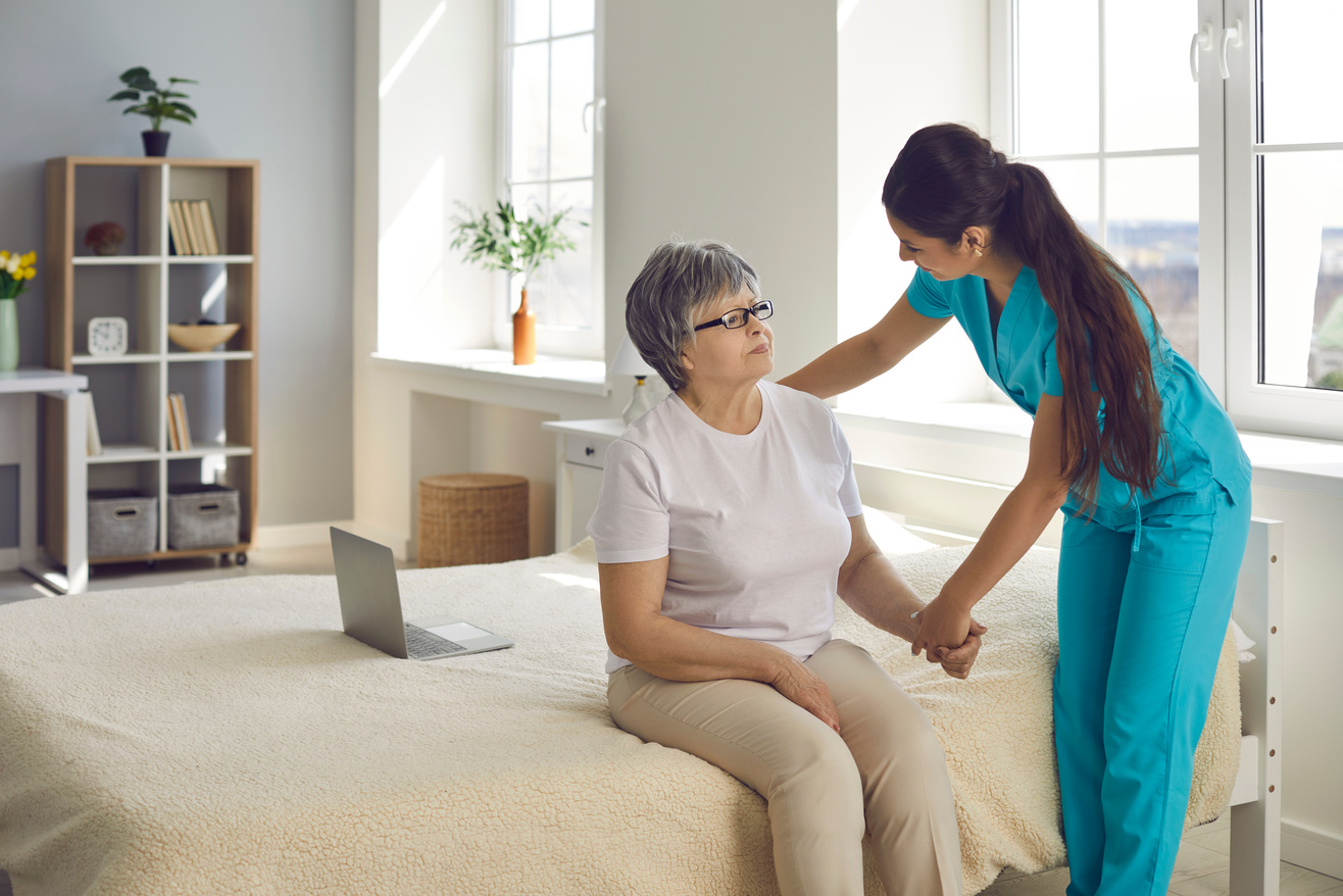 Home Care Nurse or Caregiver Supports and Assists Senior Woman with All Her Daily Needs